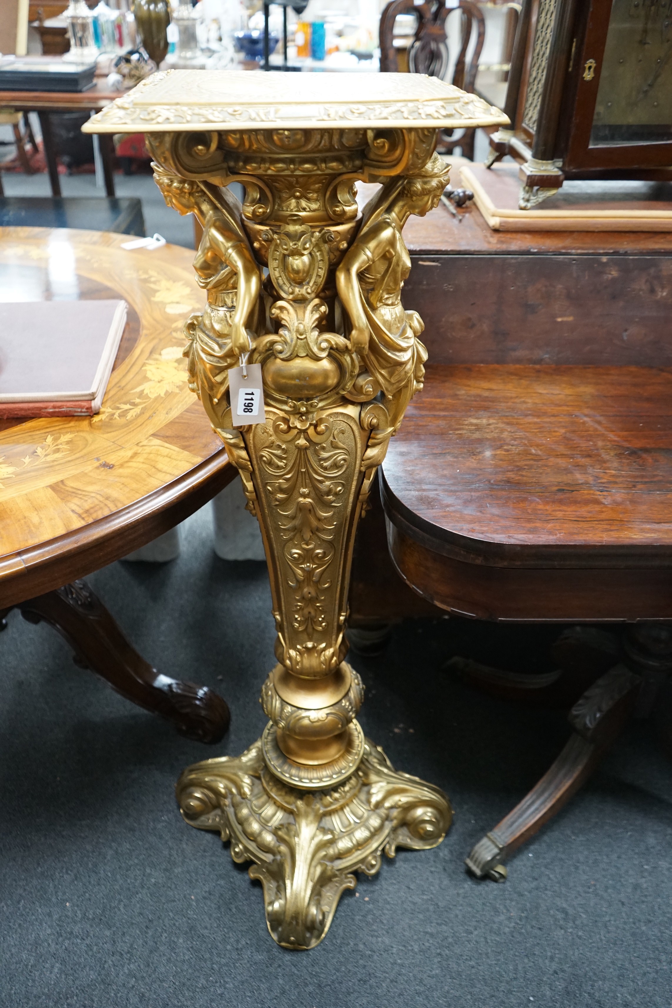 A Neo Classical style gilt spelter pedestal, cast with female busts and oval cartouche, height 115cm